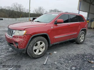 2011 Jeep Grand Cherokee Laredo with VIN 1J4RR4GT1BC542031, listed as a Copart auction lot 42792985 with 221,000 mi miles and Salvage Title. Bid and sale history available at carsss.com. Image 1.