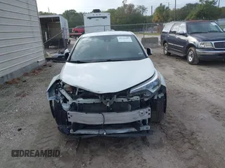 2018 Toyota C-HR XLE with VIN JTNKHMBX3J1010211, listed as a IAAI auction lot 40799443 with 104,148 mi miles. Bid and sale history available at carsss.com. Image 13.