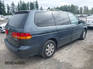 2004 Honda Odyssey EX-L with VIN 5FNRL18064B066763, listed as a IAAI auction lot 42588622 with 499,993 mi miles and . Bid and sale history available at DreamBid. Image 4.