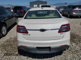 2015 Ford Taurus SEL z VIN 1FAHP2E8XFG181929, wystawiony jako Copart lot #64022325 z przebiegiem 106 272 mil mil oraz Szkoda całkowita • Salvage title. Historia ofert i sprzedaży dostępna na DreamBid. Obrazek 6.