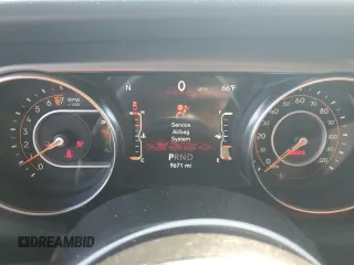 2023 Jeep Gladiator Rubicon with VIN 1C6JJTBG8PL550219, listed as a Copart auction lot 54627685 with 9,671 mi miles and Salvage title. Bid and sale history available at DreamBid. Image 9.