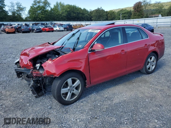 2009 Volkswagen Jetta SE with VIN 3VWRZ71K69M177746, listed as a Copart auction lot 70990074 with 128,390 mi miles and Salvage title. Bid and sale history available at DreamBid. Image 1.