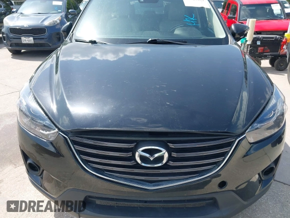 2016 Mazda CX-5 Grand Touring z VIN JM3KE2DY2G0765444, wystawiony jako IAAI lot #42527577 z przebiegiem 162 871 mil mil oraz . Historia ofert i sprzedaży dostępna na DreamBid. Obrazek 6.