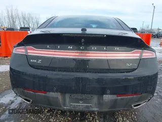 2016 Lincoln MKZ z VIN 3LN6L2JK8GR602793, wystawiony jako IAAI lot #41744058 z przebiegiem 105 234 mil mil oraz . Historia ofert i sprzedaży dostępna na DreamBid. Obrazek 16.