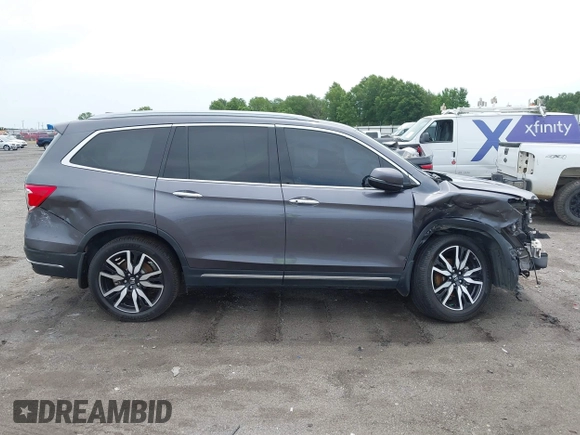 2019 Honda Pilot Touring 8-Passenger with VIN 5FNYF5H93KB028641, listed as a IAAI auction lot 42524078 with 56,744 mi miles and . Bid and sale history available at DreamBid. Image 14.