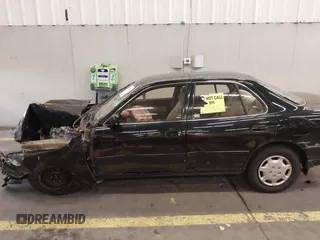 1994 Toyota Camry LE with VIN JT2SK12E3R0207215, listed as a IAAI auction lot 41788670 with 124,010 mi miles. Bid and sale history available at carsss.com. Image 15.
