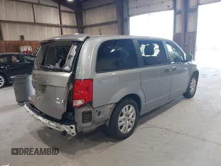 2019 Dodge Grand Caravan SE with VIN 2C4RDGBG3KR571537, listed as a IAAI auction lot 42036875 with 95,190 mi miles and . Bid and sale history available at DreamBid. Image 4.