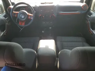 2012 Jeep Wrangler Unlimited Sport with VIN 1C4BJWDG0CL200802, listed as a Copart auction lot 63822365 with 116,501 mi miles and Salvage title. Bid and sale history available at DreamBid. Image 8.