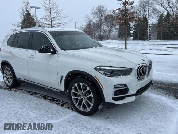 2021 BMW X5 xDrive40i with VIN 5UXCR6C03M9G52955, listed as a Copart auction lot 41009913 with 7,476 mi miles. Bid and sale history available at carsss.com. Image 1.