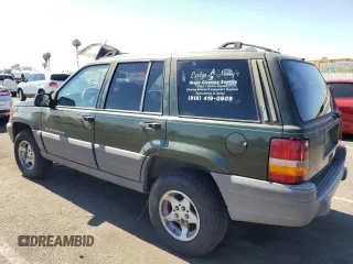 1996 Jeep Grand Cherokee Laredo with VIN 1J4FX58S1TC169501, listed as a Copart auction lot 59143174 with 0 mi miles and Salvage Title. Bid and sale history available at carsss.com. Image 2.
