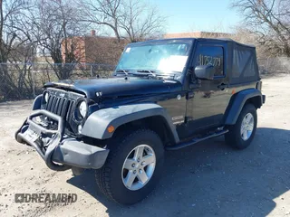 2014 Jeep Wrangler Sport with VIN 1C4AJWAGXEL319749, listed as a IAAI auction lot 41752779 with 140,045 mi miles and . Bid and sale history available at DreamBid. Image 2.