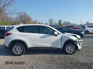 2016 Mazda CX-5 Sport with VIN JM3KE2BY2G0819604, listed as a IAAI auction lot 42059846 with 124,911 mi miles. Bid and sale history available at carsss.com. Image 13.