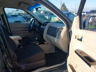 2008 Mazda Tribute Touring with VIN 4F2CZ96168KM05738, listed as a IAAI auction lot 41403675 with 217,593 mi miles. Bid and sale history available at carsss.com. Image 5.