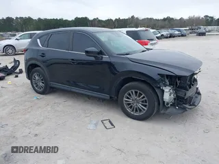 2017 Mazda CX-5 Sport with VIN JM3KFBBL5H0163935, listed as a IAAI auction lot 41186728 with 106,999 mi miles. Bid and sale history available at carsss.com. Image 1.