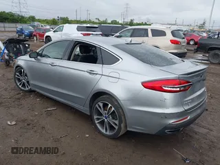 2020 Ford Fusion Titanium with VIN 3FA6P0D98LR115437, listed as a IAAI auction lot 42331052 with 127,346 mi miles and . Bid and sale history available at DreamBid. Image 3.