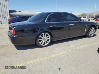 2009 Jaguar XJ 8 with VIN SAJWA71B79SH30431, listed as a Copart auction lot 52403185 with 67,143 mi miles and Salvage Title. Bid and sale history available at DreamBid. Image 3.