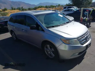 2011 Honda Odyssey Touring with VIN 5FNRL5H93BB014297, listed as a IAAI auction lot 40493230 with 188,984 mi miles and . Bid and sale history available at DreamBid. Image 1.