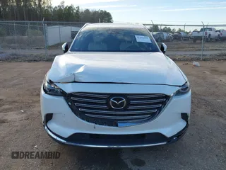 2016 Mazda CX-9 Grand Touring z VIN JM3TCADY4G0124588, wystawiony jako IAAI lot #41192549 z przebiegiem 161 272 mil mil oraz . Historia ofert i sprzedaży dostępna na DreamBid. Obrazek 12.