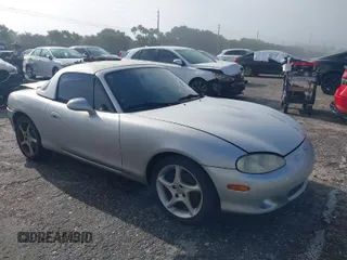 2003 Mazda MX-5 Miata Cloth with VIN JM1NB353730311899, listed as a IAAI auction lot 41929811 with 99,589 mi miles and . Bid and sale history available at DreamBid. Image 1.