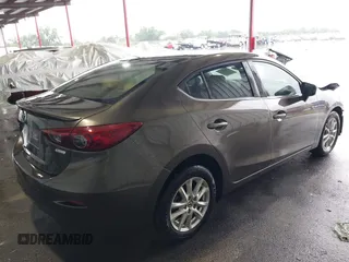 2015 Mazda 3 i Touring with VIN 3MZBM1V72FM215729, listed as a IAAI auction lot 42191673 with 141,471 mi miles and . Bid and sale history available at DreamBid. Image 4.