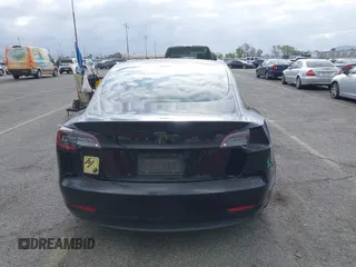 2019 Tesla Model 3 Mid Range with VIN 5YJ3E1EA3KF415601, listed as a IAAI auction lot 42125393 with 150,220 mi miles and . Bid and sale history available at carsss.com. Image 17.