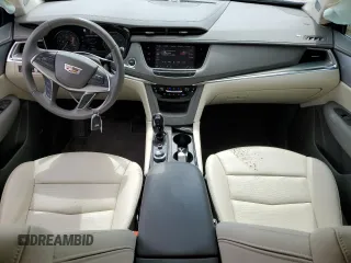 2023 Cadillac XT5 FWD Premium Luxury z VIN 1GYKNCRS5PZ173528, wystawiony jako Copart lot #55805605 z przebiegiem 7 789 mil mil oraz Szkoda całkowita • Salvage title. Historia ofert i sprzedaży dostępna na DreamBid. Obrazek 8.