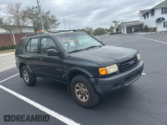 1999 Isuzu Rodeo S z VIN 4S2CK58W7X4357230, wystawiony jako Copart lot #45724855 z przebiegiem 130 446 mil mil oraz Czysty tytuł • Clean title. Historia ofert i sprzedaży dostępna na DreamBid. Obrazek 1.