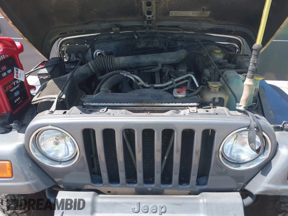 2002 Jeep Wrangler Sport z VIN 1J4FA49S62P731507, wystawiony jako IAAI lot #42584222 z przebiegiem 206 661 mil mil oraz . Historia ofert i sprzedaży dostępna na DreamBid. Obrazek 10.