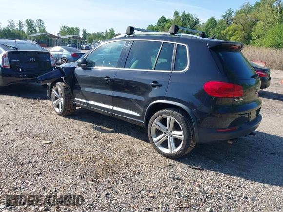 2014 Volkswagen Tiguan S z VIN WVGBV3AX5EW560393, wystawiony jako IAAI lot #42105203 z przebiegiem 102 001 mil mil oraz . Historia ofert i sprzedaży dostępna na DreamBid. Obrazek 3.