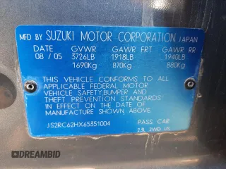 2006 Suzuki Aerio Premium z VIN JS2RC62HX65351004, wystawiony jako Copart lot #44656943 z przebiegiem Nie podano mil oraz Czysty tytuł • Clean title. Historia ofert i sprzedaży dostępna na DreamBid. Obrazek 12.