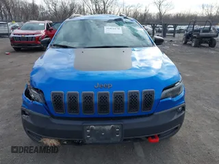 2022 Jeep Cherokee Trailhawk z VIN 1C4PJMBX1ND539319, wystawiony jako IAAI lot #41811178 z przebiegiem 49 922 mil mil oraz . Historia ofert i sprzedaży dostępna na DreamBid. Obrazek 13.