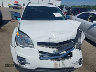 2014 Chevrolet Equinox LT z VIN 1GNALCEK7EZ122193, wystawiony jako IAAI lot #42148614 z przebiegiem 65 663 mil mil oraz . Historia ofert i sprzedaży dostępna na DreamBid. Obrazek 13.