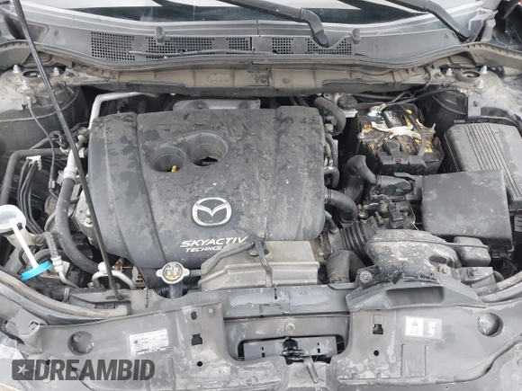 2014 Mazda CX-5 Touring z VIN JM3KE2CY3E0355332, wystawiony jako IAAI lot #42096306 z przebiegiem 108 198 mil mil oraz . Historia ofert i sprzedaży dostępna na DreamBid. Obrazek 10.