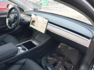 2023 Tesla Model 3 with VIN 5YJ3E1EAXPF666252, listed as a IAAI auction lot 42009929 with 27,328 mi miles and . Bid and sale history available at DreamBid. Image 5.