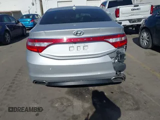 2015 Hyundai Azera z VIN KMHFG4JG0FA453994, wystawiony jako IAAI lot #42002922 z przebiegiem 102 094 mil mil oraz . Historia ofert i sprzedaży dostępna na DreamBid. Obrazek 16.