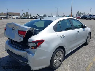 2018 Kia Rio LX with VIN 3KPA24AB4JE086105, listed as a IAAI auction lot 42062323 with 128,289 mi miles. Bid and sale history available at carsss.com. Image 4.
