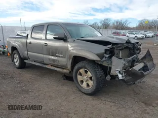 2014 Toyota Tacoma z VIN 3TMMU4FN7EM067182, wystawiony jako IAAI lot #41108551 z przebiegiem 156 398 mil mil oraz . Historia ofert i sprzedaży dostępna na DreamBid. Obrazek 1.