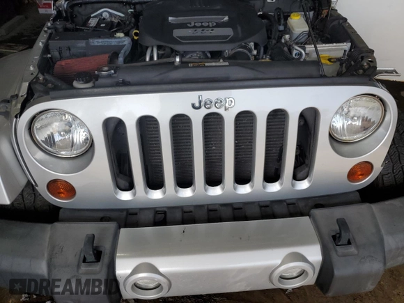 2012 Jeep Wrangler Arctic z VIN 1C4GJWBG2CL237343, wystawiony jako Copart lot #64674015 z przebiegiem 72 750 mil mil oraz Szkoda całkowita • Salvage title. Historia ofert i sprzedaży dostępna na DreamBid. Obrazek 11.