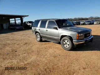1999 GMC Yukon with VIN 1GKEK13R3XJ750307, listed as a Copart auction lot 84728104 with 212,879 mi miles and Salvage Title. Bid and sale history available at carsss.com. Image 11.