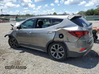 2017 Hyundai Santa Fe Ultimate z VIN 5XYZW4LA8HG491652, wystawiony jako Copart lot #56907985 z przebiegiem Nie podano mil oraz Szkoda całkowita • Salvage title. Historia ofert i sprzedaży dostępna na DreamBid. Obrazek 2.