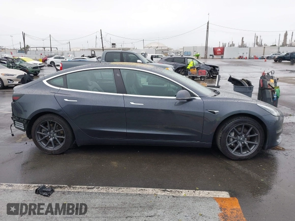2018 Tesla Model 3 Long Range Battery with VIN 5YJ3E1EB7JF114305, listed as a IAAI auction lot 41765994 with 76,945 mi miles and . Bid and sale history available at DreamBid. Image 14.