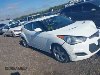 2013 Hyundai Veloster w/Gray Int with VIN KMHTC6AD2DU115735, listed as a IAAI auction lot 39404347 with 166,840 mi miles and . Bid and sale history available at DreamBid. Image 1.