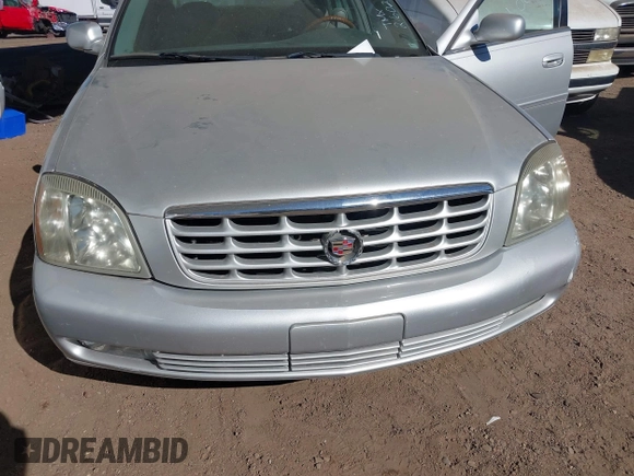 2003 Cadillac DeVille DTS z VIN 1G6KF57923U260229, wystawiony jako IAAI lot #41415468 z przebiegiem 58 012 mil mil oraz . Historia ofert i sprzedaży dostępna na DreamBid. Obrazek 6.