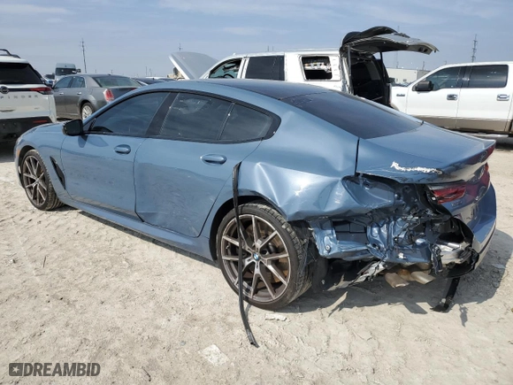 2022 BMW 8 Series M850i with VIN WBAGV8C06NCH98097, listed as a Copart auction lot 43779565 with 18,740 mi miles and Salvage Title. Bid and sale history available at carsss.com. Image 2.