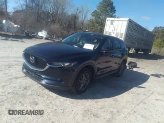 2020 Mazda CX-5 Touring with VIN JM3KFACM1L1817303, listed as a IAAI auction lot 41627859 with 57,268 mi miles. Bid and sale history available at carsss.com. Image 2.
