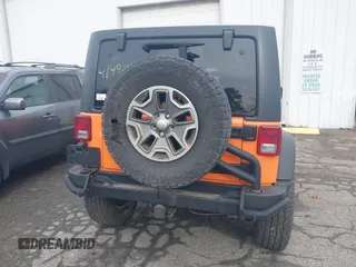 2013 Jeep Wrangler Unlimited Sport z VIN 1C4BJWDG7DL522421, wystawiony jako IAAI lot #41492425 z przebiegiem 55 921 mil mil oraz . Historia ofert i sprzedaży dostępna na DreamBid. Obrazek 16.