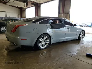2013 Jaguar XJ with VIN SAJWJ1CD1D8V51462, listed as a Copart auction lot 50527985 with 62,995 mi miles and Salvage title. Bid and sale history available at DreamBid. Image 3.