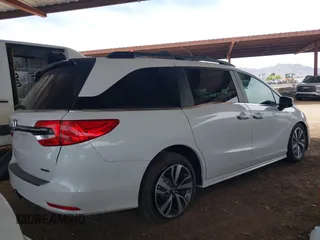 2021 Honda Odyssey Touring z VIN 5FNRL6H85MB034888, wystawiony jako IAAI lot #42386984 z przebiegiem 40 514 mil mil oraz . Historia ofert i sprzedaży dostępna na DreamBid. Obrazek 4.