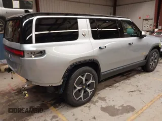 2024 Rivian R1S Adventure with VIN 7PDSGABA9RN039601, listed as a IAAI auction lot 40862472 with 6,186 mi miles. Bid and sale history available at carsss.com. Image 4.
