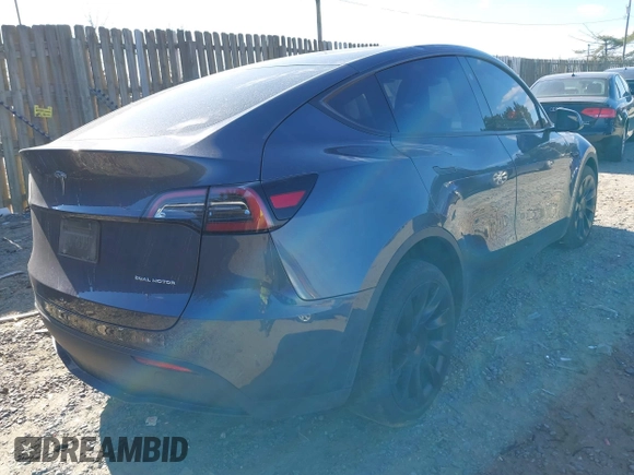 2023 Tesla Model Y Long Range with VIN 7SAYGDEE4PA145922, listed as a IAAI auction lot 41771974 with 22,670 mi miles. Bid and sale history available at carsss.com. Image 4.